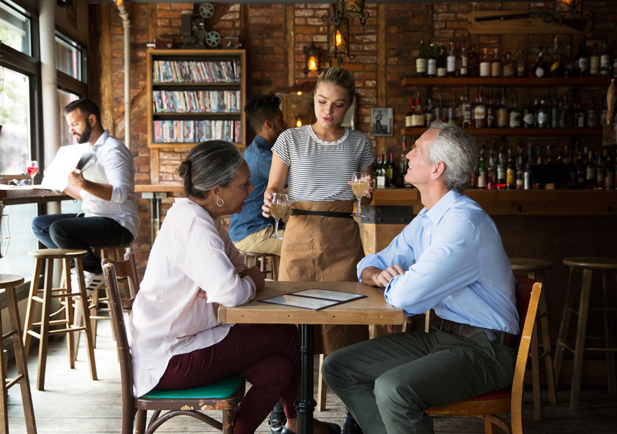 old people ordering coffee from a waitress