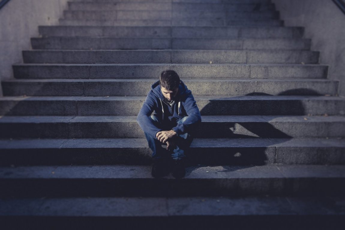sad boy on stairs